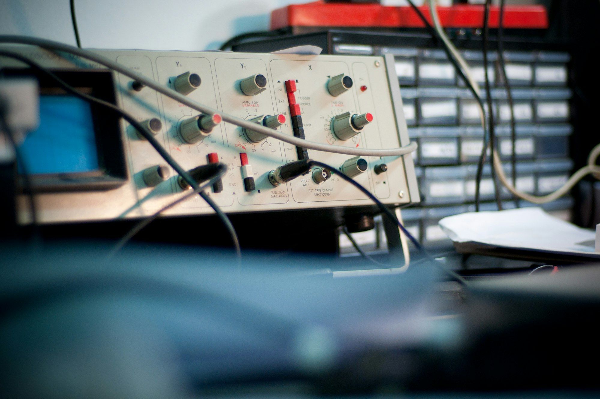 Electronic test equipment with dials and cables on a lab bench